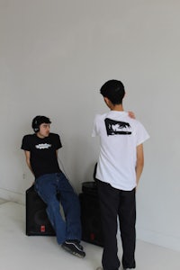 two men standing in a room