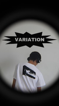 a man wearing a t - shirt with the word variation on it